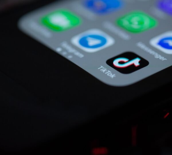 black iphone 4 on black textile